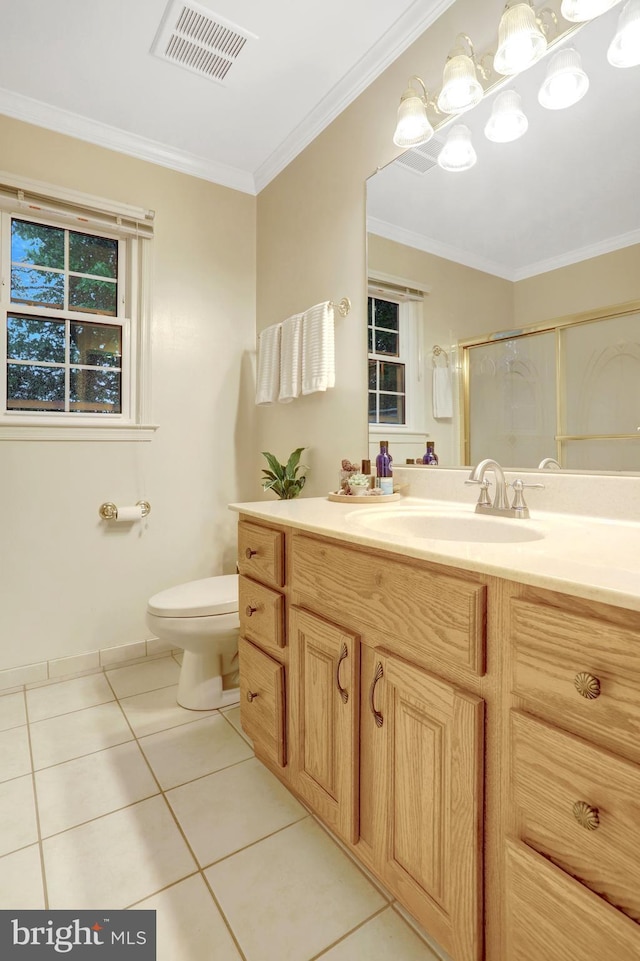 7117 Stanchion Ln, Burke, VA 22015 - bathroom featuring tile patterned floors, a stall shower, ornamental molding, vanity, and toilet