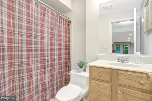 7117 Stanchion Ln, Burke, VA 22015 - full bathroom with vanity, toilet, and a shower with curtain