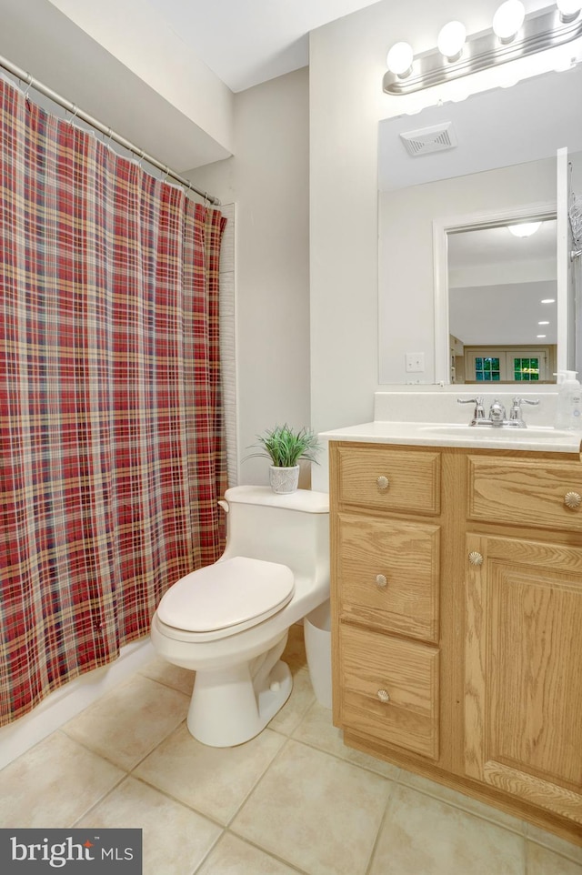 7117 Stanchion Ln, Burke, VA 22015 - full bathroom featuring toilet, tile patterned floors, vanity, and a shower with shower curtain