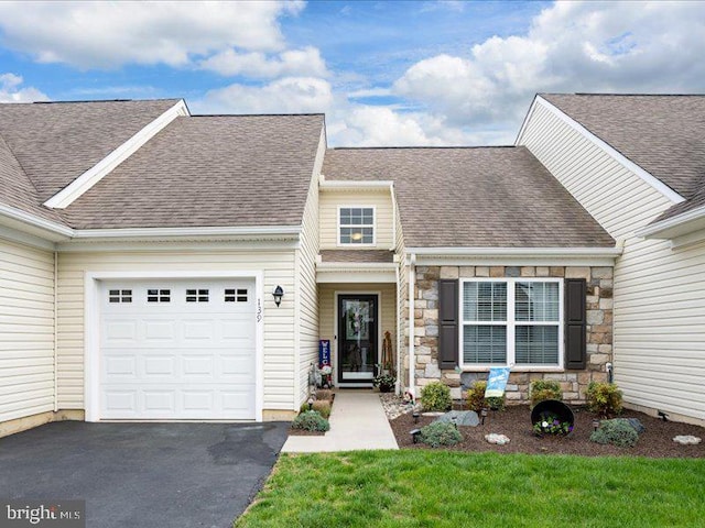 139 Gazebo Ln, Middletown, DE 19709 - view of front of home with a garage, driveway, a shingled roof, and stone siding