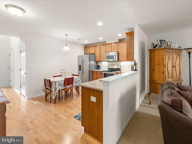 139 Gazebo Ln, Middletown, DE 19709 - kitchen featuring stainless steel appliances, baseboards, recessed lighting, light wood-style floors, and light countertops