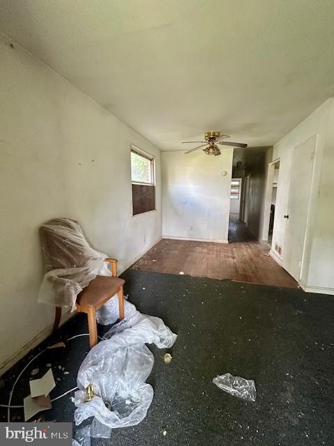 interior space featuring a ceiling fan