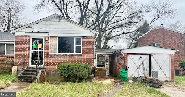 bungalow-style house featuring brick siding