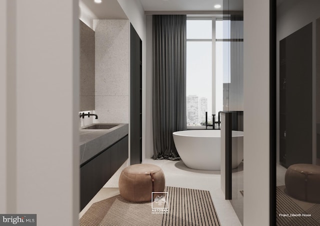 full bath with a soaking tub and vanity