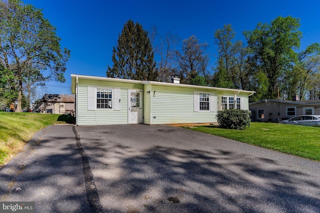 view of front of home with a front lawn