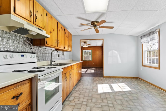 kitchen with a ceiling fan, a sink, baseboards, white range with electric stovetop, and under cabinet range hood