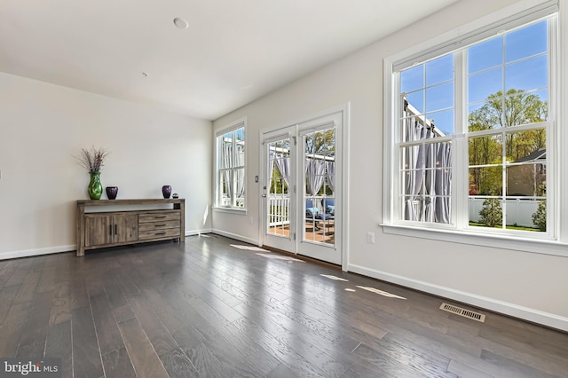 3419 Pocahontas Dr, Edgewater, MD 21037 - empty room featuring visible vents, baseboards, and dark wood-style floors