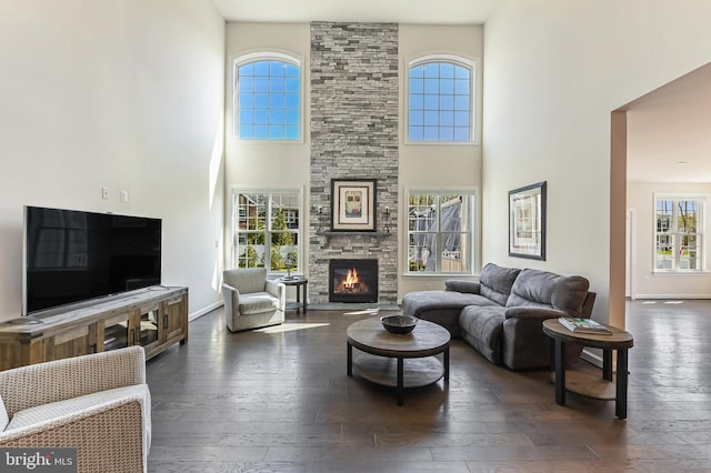 3419 Pocahontas Dr, Edgewater, MD 21037 - living room with a towering ceiling, a wealth of natural light, and dark wood-type flooring