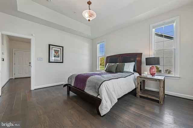 3419 Pocahontas Dr, Edgewater, MD 21037 - bedroom with a tray ceiling, dark wood-style floors, and baseboards