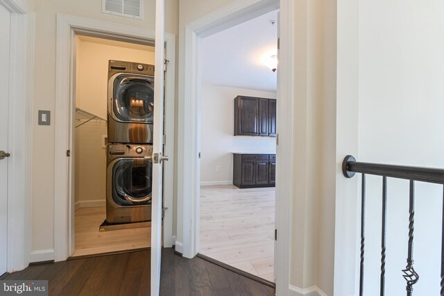3419 Pocahontas Dr, Edgewater, MD 21037 - washroom with stacked washer and dryer, baseboards, visible vents, and dark wood finished floors