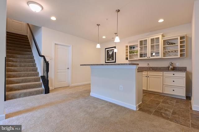 3419 Pocahontas Dr, Edgewater, MD 21037 - kitchen featuring open shelves, baseboards, a sink, and dark carpet