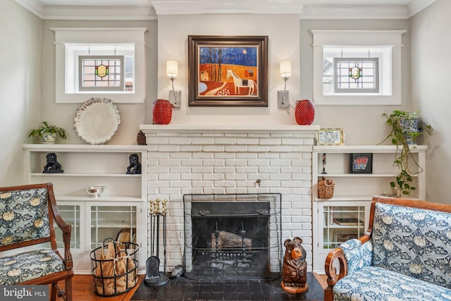3213 Jocelyn St NW, Washington, DC 20015 - living area featuring plenty of natural light, wood finished floors, crown molding, and a brick fireplace