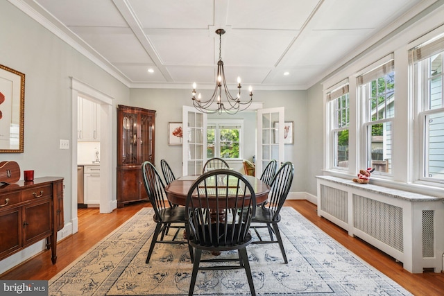 3213 Jocelyn St NW, Washington, DC 20015 - dining room with radiator, a chandelier, healthy amount of natural light, light wood-style floors, and coffered ceiling