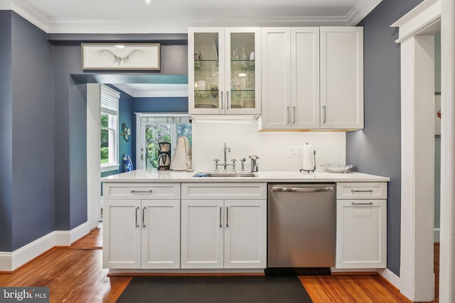 3213 Jocelyn St NW, Washington, DC 20015 - indoor wet bar featuring stainless steel dishwasher, wood finished floors, backsplash, and crown molding