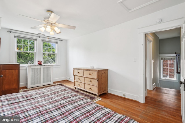 3213 Jocelyn St NW, Washington, DC 20015 - bedroom with wood finished floors, radiator, a ceiling fan, and attic access