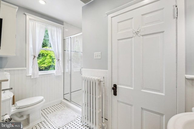 3213 Jocelyn St NW, Washington, DC 20015 - bathroom with radiator heating unit, a wainscoted wall, a stall shower, and recessed lighting