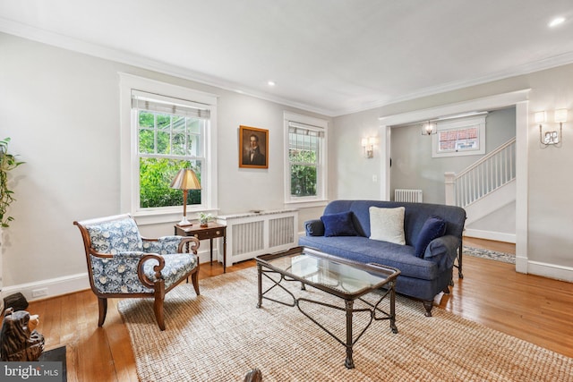 3213 Jocelyn St NW, Washington, DC 20015 - living room with radiator, crown molding, wood-type flooring, stairway, and recessed lighting