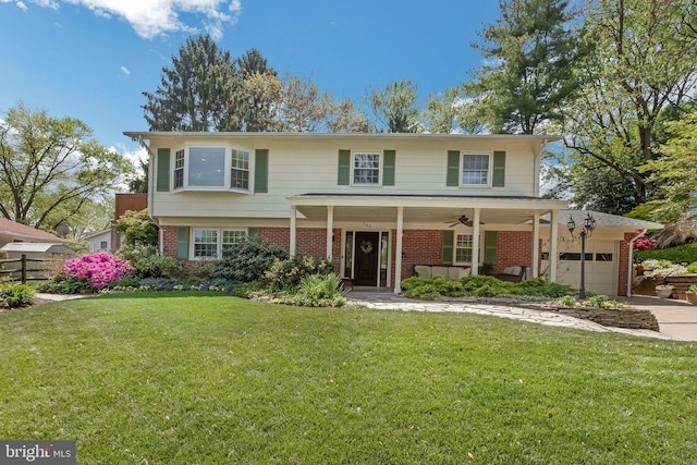 705 Hope Ln, Gaithersburg, MD 20878 - traditional home with a front lawn, brick siding, a garage, a porch, and driveway