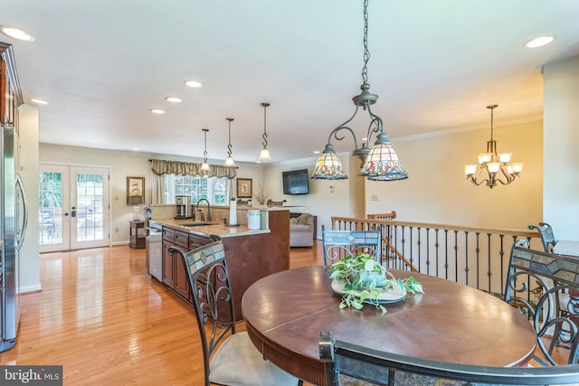 705 Hope Ln, Gaithersburg, MD 20878 - dining space with recessed lighting, a notable chandelier, french doors, and light wood-style flooring