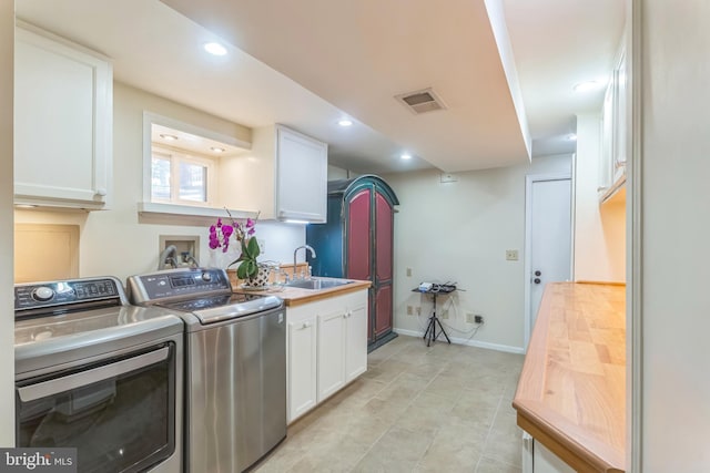 705 Hope Ln, Gaithersburg, MD 20878 - washroom with visible vents, a sink, baseboards, recessed lighting, and washer and dryer