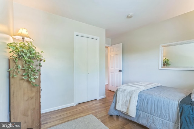 705 Hope Ln, Gaithersburg, MD 20878 - bedroom featuring baseboards, wood finished floors, and a closet