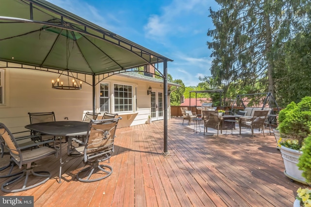 705 Hope Ln, Gaithersburg, MD 20878 - wooden deck with outdoor dining area, french doors, and a gazebo