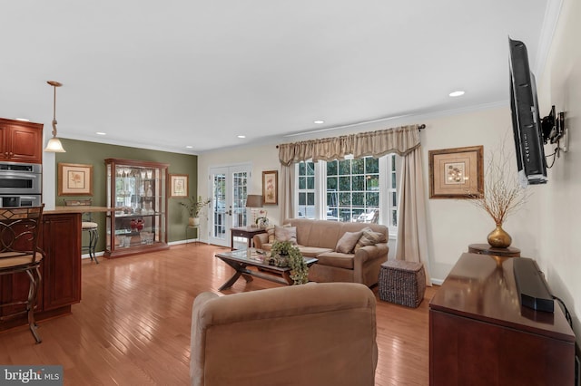 705 Hope Ln, Gaithersburg, MD 20878 - living room with recessed lighting, french doors, ornamental molding, and light wood-style flooring