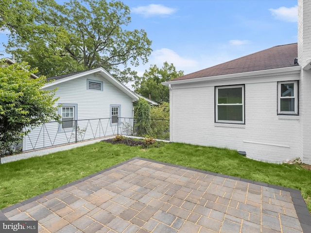 402 Elm Ave, Takoma Park, MD 20912 - back of house featuring a patio, brick siding, a chimney, and roof with shingles