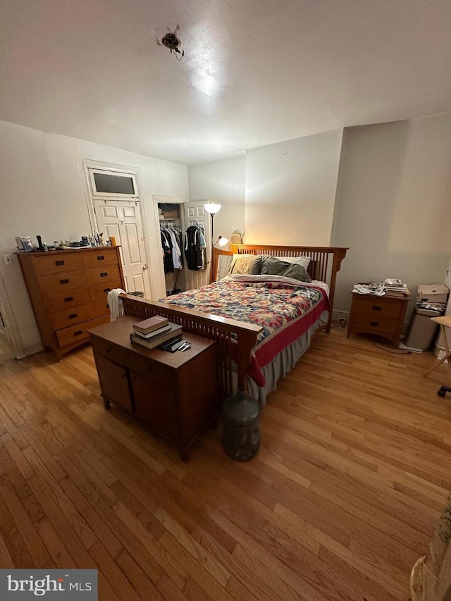 bedroom with light wood-style floors