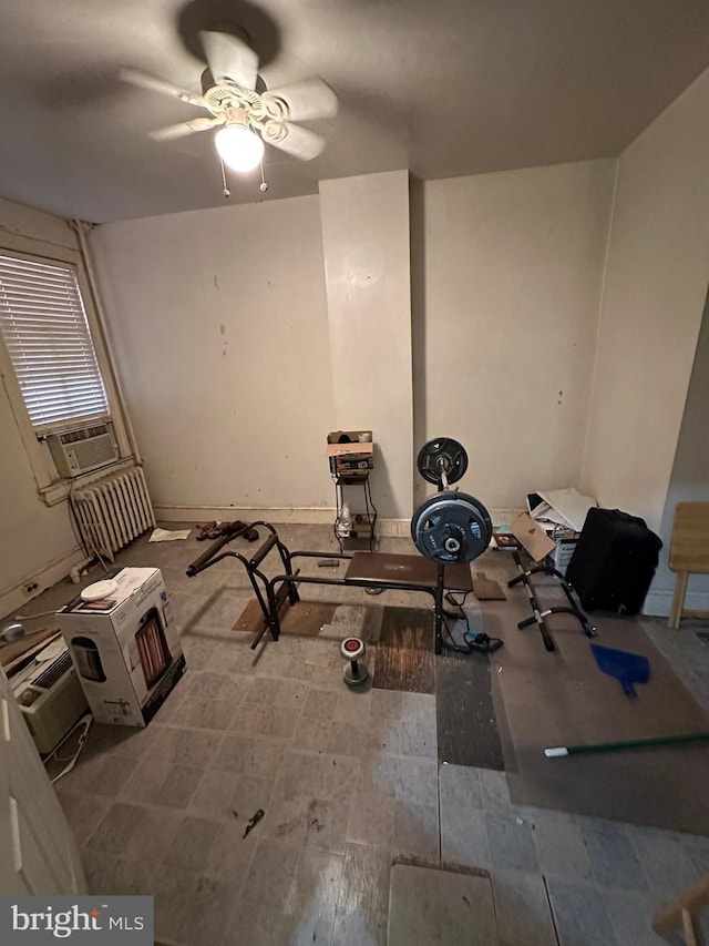interior space with ceiling fan and cooling unit