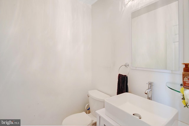 bathroom featuring a sink and toilet