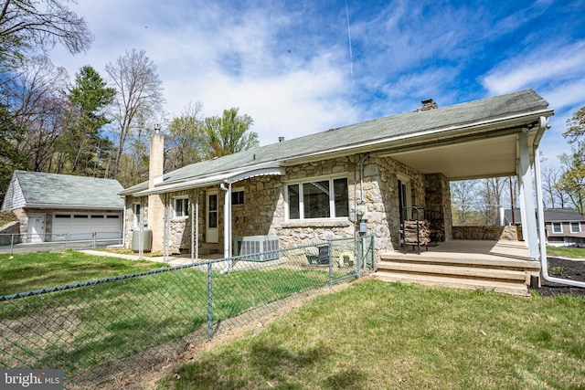 330 Church Lane Rd, Reading, PA 19606 - view of front of home featuring a detached garage, stone siding, a chimney, covered porch, and fence private yard