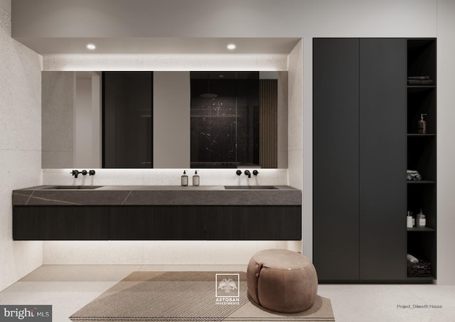 bathroom featuring double vanity, a sink, recessed lighting, and built in shelves