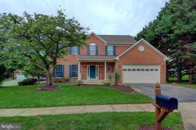 13434 Fairland Park Dr, Silver Spring, MD 20904 - view of front facade featuring driveway, a garage, a front lawn, and brick siding