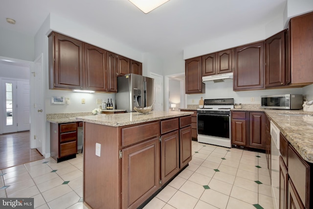 13434 Fairland Park Dr, Silver Spring, MD 20904 - kitchen featuring appliances with stainless steel finishes, under cabinet range hood, light tile patterned floors, and light stone counters