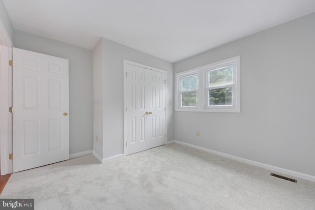 13434 Fairland Park Dr, Silver Spring, MD 20904 - unfurnished bedroom featuring carpet floors, baseboards, and a closet