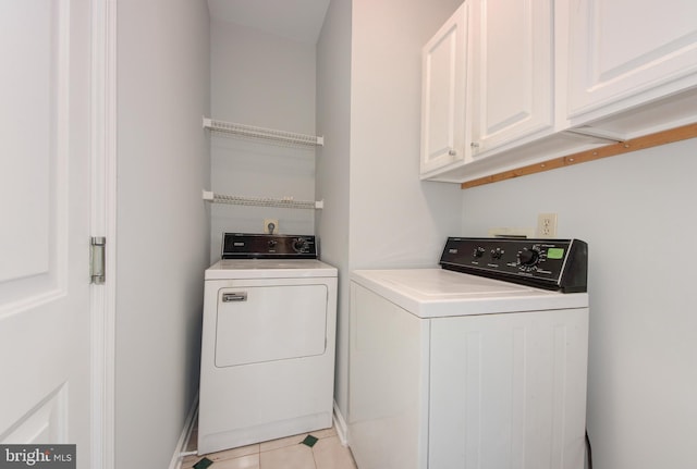 13434 Fairland Park Dr, Silver Spring, MD 20904 - laundry area featuring washing machine and clothes dryer, cabinet space, and light tile patterned floors