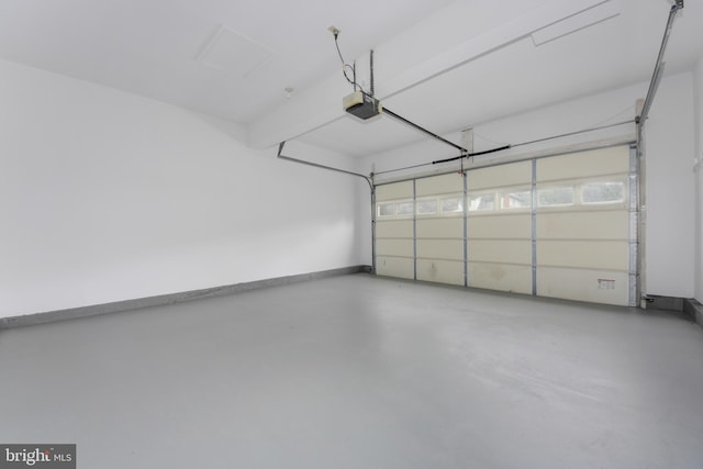 13434 Fairland Park Dr, Silver Spring, MD 20904 - garage with a garage door opener and baseboards