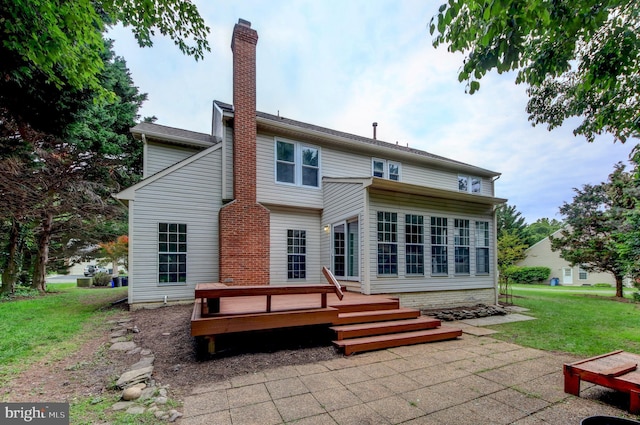 13434 Fairland Park Dr, Silver Spring, MD 20904 - rear view of house featuring a deck, a lawn, and a chimney