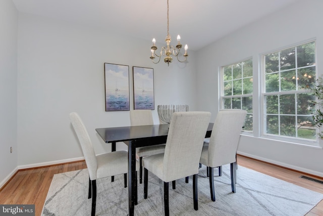 13434 Fairland Park Dr, Silver Spring, MD 20904 - dining area featuring wood finished floors, a chandelier, and baseboards