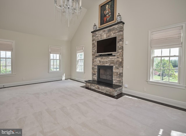 2727 Aquetong Rd, New Hope, PA 18938 - unfurnished living room featuring a notable chandelier, high vaulted ceiling, a wealth of natural light, and a fireplace