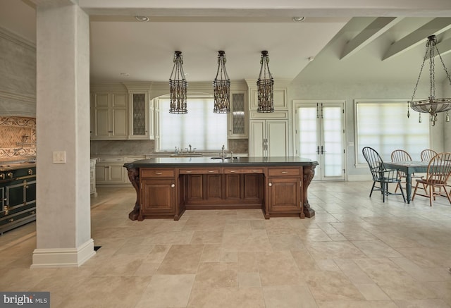 2727 Aquetong Rd, New Hope, PA 18938 - kitchen featuring dark countertops, plenty of natural light, glass insert cabinets, and a sink