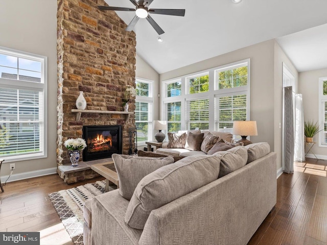 32953 Shadeland Ave, Millsboro, DE 19966 - living room with baseboards, a stone fireplace, dark wood-style floors, a ceiling fan, and vaulted ceiling