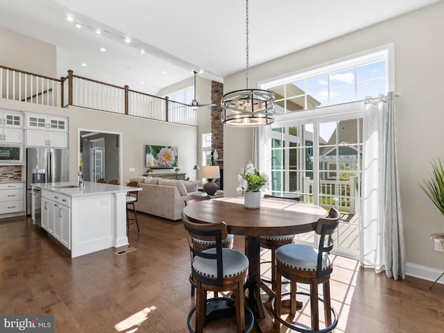 32953 Shadeland Ave, Millsboro, DE 19966 - dining space with plenty of natural light, recessed lighting, dark wood finished floors, and a chandelier