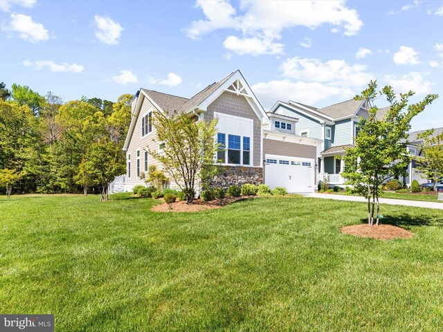 32953 Shadeland Ave, Millsboro, DE 19966 - craftsman-style house with a garage, driveway, a front lawn, and stone siding