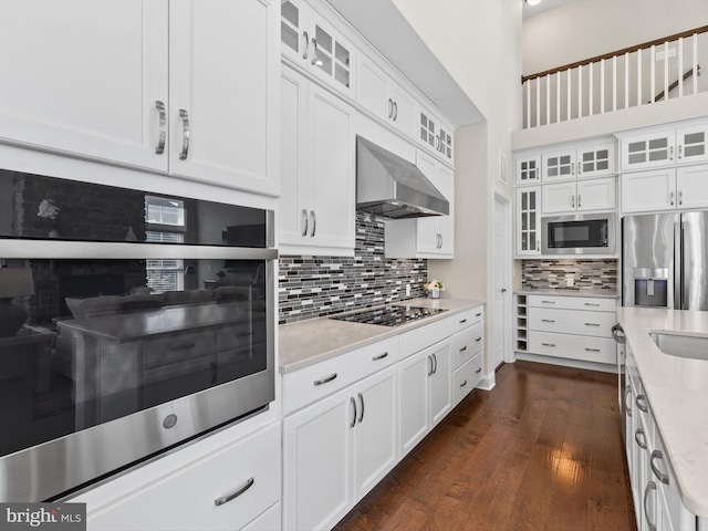 32953 Shadeland Ave, Millsboro, DE 19966 - kitchen with wall chimney range hood, white cabinetry, appliances with stainless steel finishes, and decorative backsplash