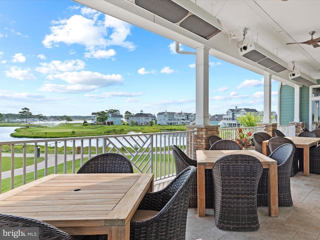 32953 Shadeland Ave, Millsboro, DE 19966 - view of patio / terrace with a water view, ceiling fan, outdoor dining area, and a balcony