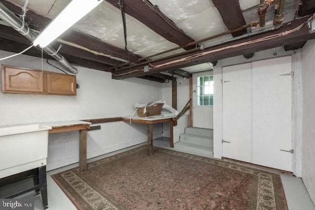 basement featuring stairway