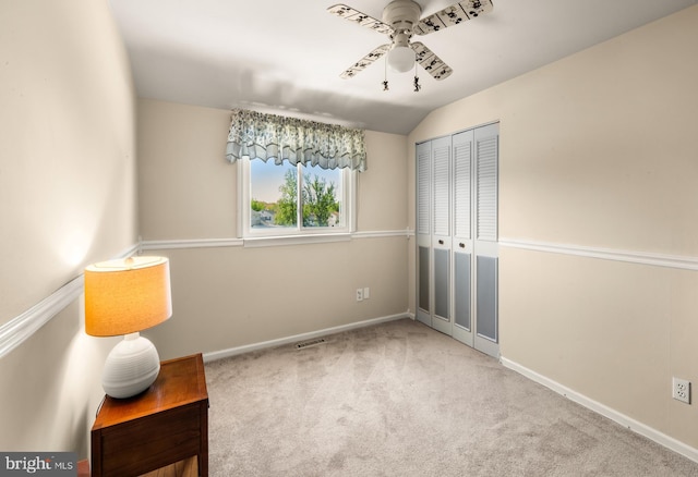 unfurnished room with baseboards, carpet flooring, ceiling fan, and visible vents