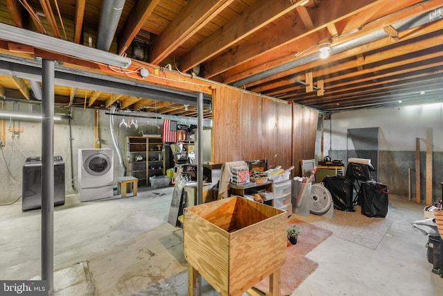 unfinished basement with independent washer and dryer
